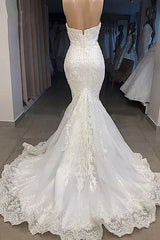 Try this glamorous Amazing Sweetheart Mermaid White Wedding Dress Online to wow your wedding guests with stylesnuggle. The Strapless,Sweetheart design and exqusite handwork, and the Floor-length wedding dress with Lace,Appliques to provide the cool and simple look for summer wedding.