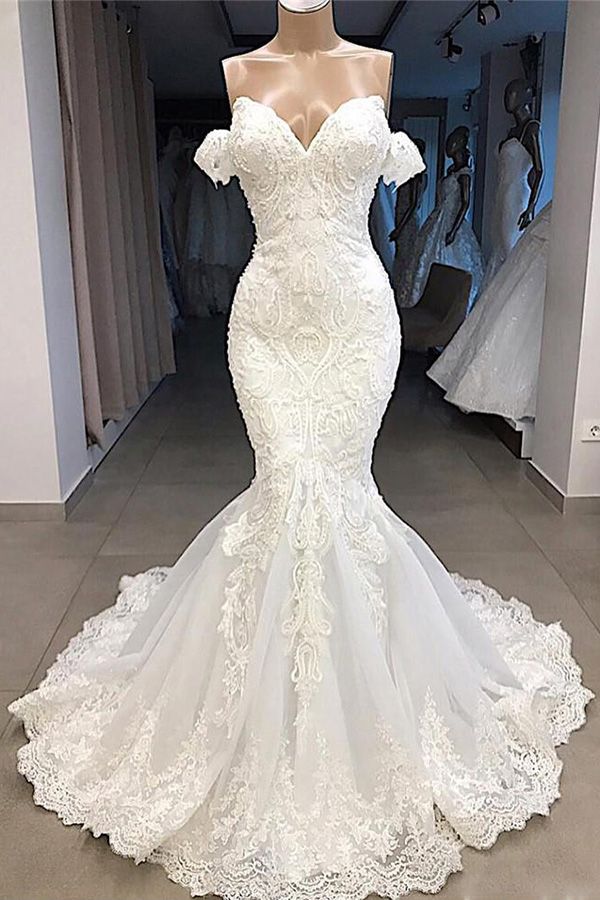 Try this glamorous Amazing Sweetheart Mermaid White Wedding Dress Online to wow your wedding guests with stylesnuggle. The Strapless,Sweetheart design and exqusite handwork, and the Floor-length wedding dress with Lace,Appliques to provide the cool and simple look for summer wedding.