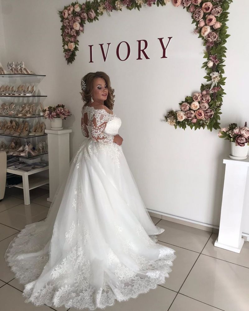 stylesnuggle offers Amazing Off-the-Shoulder Long Sleevess Lace Princess Plus size wedding dress at factory price from White,Ivory,Champagne,Black, Lace to A-line Floor-length hem.