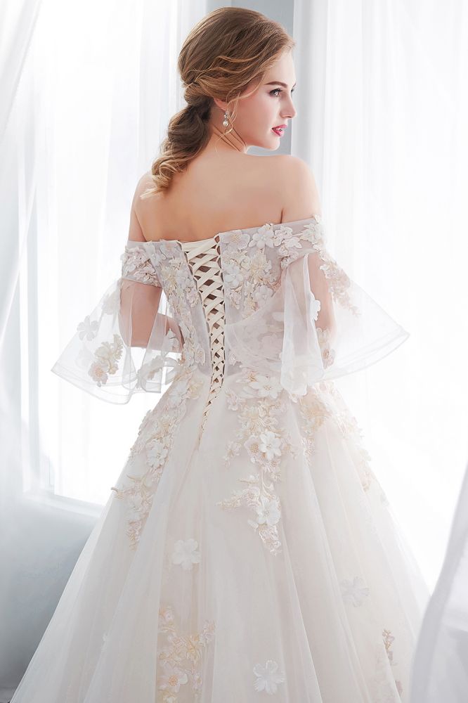 Check this Ball Gown Off-the-shoulder Floor Length Appliques Tulle Wedding Dresses at stylesnuggle.com, this dress will make your guests say wow. The Off-the-shoulder bodice is thoughtfully lined, and the Floor-length skirt with Appliques to provide the airy, flatter look of Satin,Tulle.