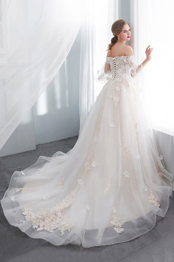 Check this Ball Gown Off-the-shoulder Floor Length Appliques Tulle Wedding Dresses at stylesnuggle.com, this dress will make your guests say wow. The Off-the-shoulder bodice is thoughtfully lined, and the Floor-length skirt with Appliques to provide the airy, flatter look of Satin,Tulle.