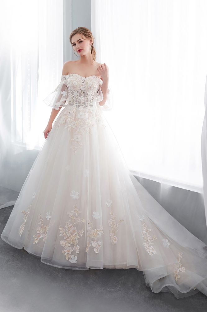 Check this Ball Gown Off-the-shoulder Floor Length Appliques Tulle Wedding Dresses at stylesnuggle.com, this dress will make your guests say wow. The Off-the-shoulder bodice is thoughtfully lined, and the Floor-length skirt with Appliques to provide the airy, flatter look of Satin,Tulle.