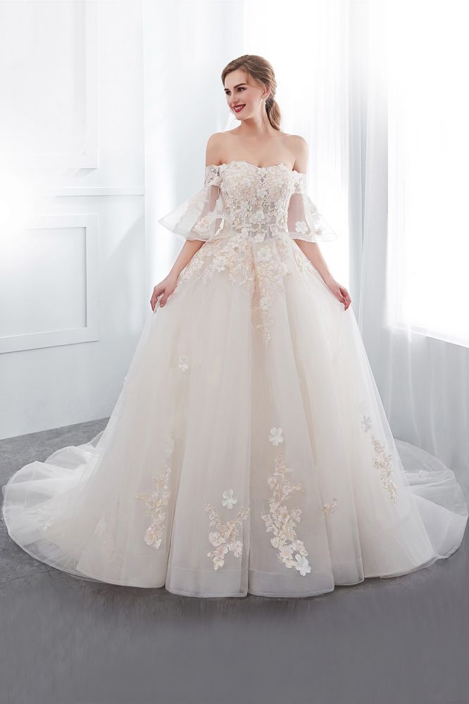 Check this Ball Gown Off-the-shoulder Floor Length Appliques Tulle Wedding Dresses at stylesnuggle.com, this dress will make your guests say wow. The Off-the-shoulder bodice is thoughtfully lined, and the Floor-length skirt with Appliques to provide the airy, flatter look of Satin,Tulle.