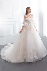 Check this Ball Gown Off-the-shoulder Floor Length Appliques Tulle Wedding Dresses at stylesnuggle.com, this dress will make your guests say wow. The Off-the-shoulder bodice is thoughtfully lined, and the Floor-length skirt with Appliques to provide the airy, flatter look of Satin,Tulle.