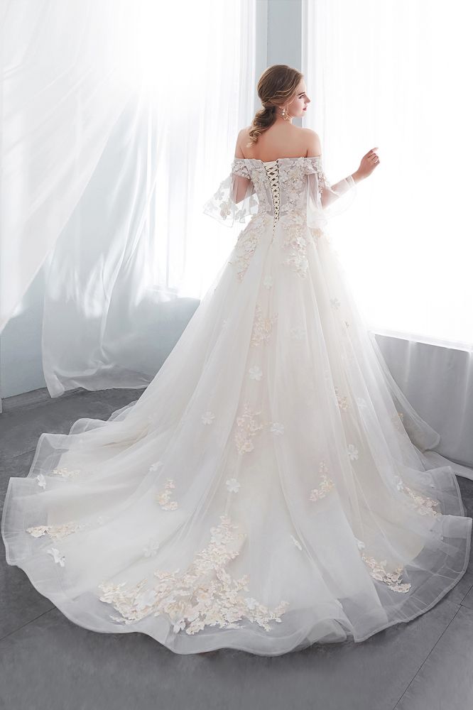 Check this Ball Gown Off-the-shoulder Floor Length Appliques Tulle Wedding Dresses at stylesnuggle.com, this dress will make your guests say wow. The Off-the-shoulder bodice is thoughtfully lined, and the Floor-length skirt with Appliques to provide the airy, flatter look of Satin,Tulle.