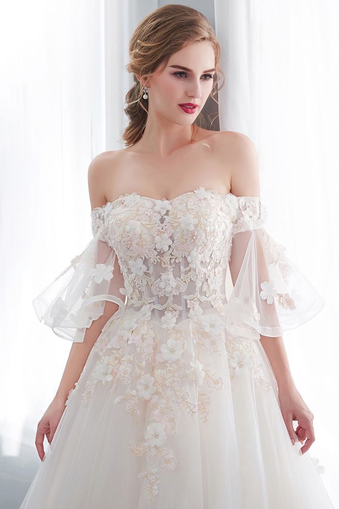 Check this Ball Gown Off-the-shoulder Floor Length Appliques Tulle Wedding Dresses at stylesnuggle.com, this dress will make your guests say wow. The Off-the-shoulder bodice is thoughtfully lined, and the Floor-length skirt with Appliques to provide the airy, flatter look of Satin,Tulle.