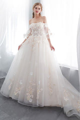 Check this Ball Gown Off-the-shoulder Floor Length Appliques Tulle Wedding Dresses at stylesnuggle.com, this dress will make your guests say wow. The Off-the-shoulder bodice is thoughtfully lined, and the Floor-length skirt with Appliques to provide the airy, flatter look of Satin,Tulle.