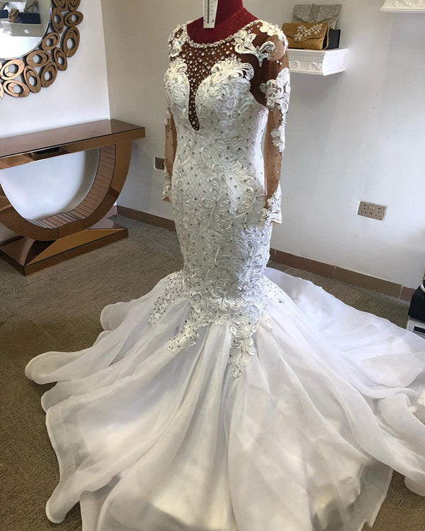 Inspired by this mermaid wedding dress at stylesnuggle.com, we meet all your needs with this Classic Beading Mermaid Sheer Tulle Wedding Dress.