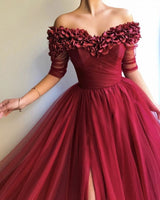 stylesnuggle offers all kinds of burgundy evening dresses online,  sort by color,  neckline or fabric. Discover more styles Burgundy A-line Off-the-Shoulder Tulle Flower Applique Prom Dresses that will match you preferctly now.