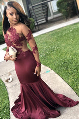 Rock a stunning,  youthful look with our Burgundy Long Sleevess Open Back Mermaid Prom Dress. Shop stylesnuggle with free shipping on See-Through Appliques Evening Gowns available in all sizes and colors.