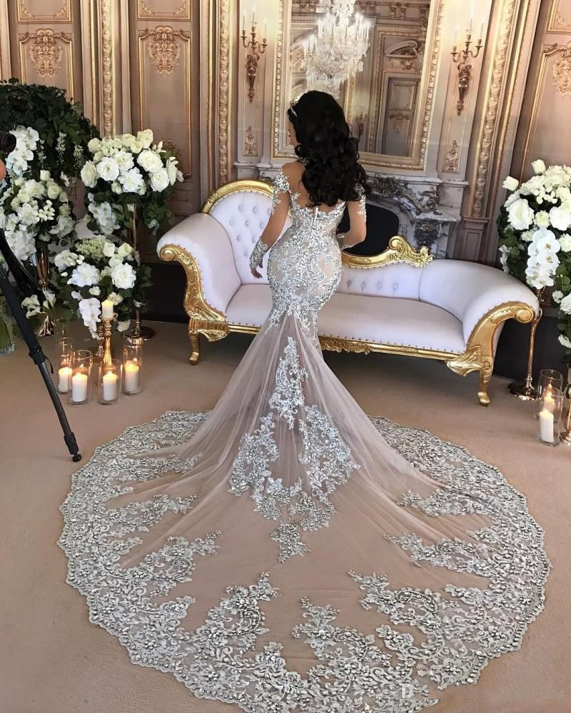 Wanna get a dress in Mermaid style, and delicate Lace,Crystal work? stylesnuggle custom made you this Classic High neck Long Sleevess Mermaid Wedding Dress Silver Tulle Bridal Gowns with Lace Appliques at factory price.