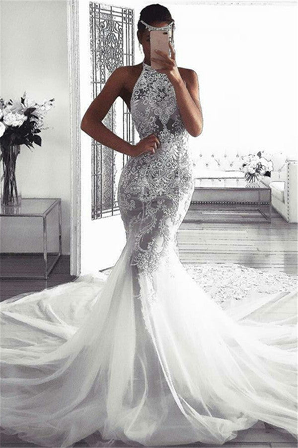 stylesnuggle custom made this mermaid sleeveless halter wedding dress online, we sell dresses online all over the world. Also, extra discount are offered to our customs. We will try our best to satisfy everyoneone and make the dress fit you well.