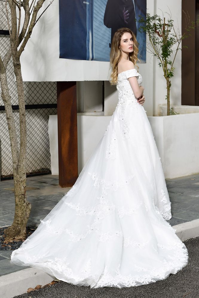 Looking for a perfect dress for your big day. stylesnuggle has Classic White Lace Off-the-Shoulder Wedding Dress avilable in White, Ivroy and champange. Try this simple bridal gowns for your summer wedding.