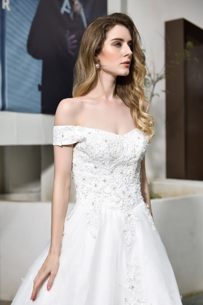 Looking for a perfect dress for your big day. stylesnuggle has Classic White Lace Off-the-Shoulder Wedding Dress avilable in White, Ivroy and champange. Try this simple bridal gowns for your summer wedding.