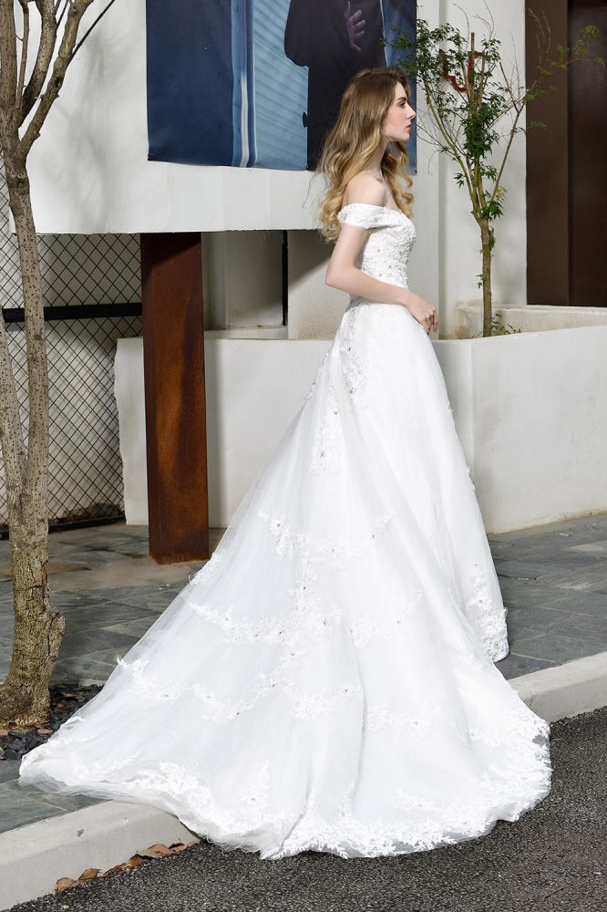 Looking for a perfect dress for your big day. stylesnuggle has Classic White Lace Off-the-Shoulder Wedding Dress avilable in White, Ivroy and champange. Try this simple bridal gowns for your summer wedding.