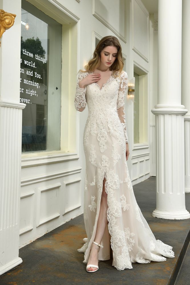 Searching for a perfect wedding dress for your big day. stylesnuggle has Delicate V-Neck High Split Long Sleevess Lace Wedding Dress avilable in White, Ivroy and champange. Try this simple bridal gowns for your summer wedding.