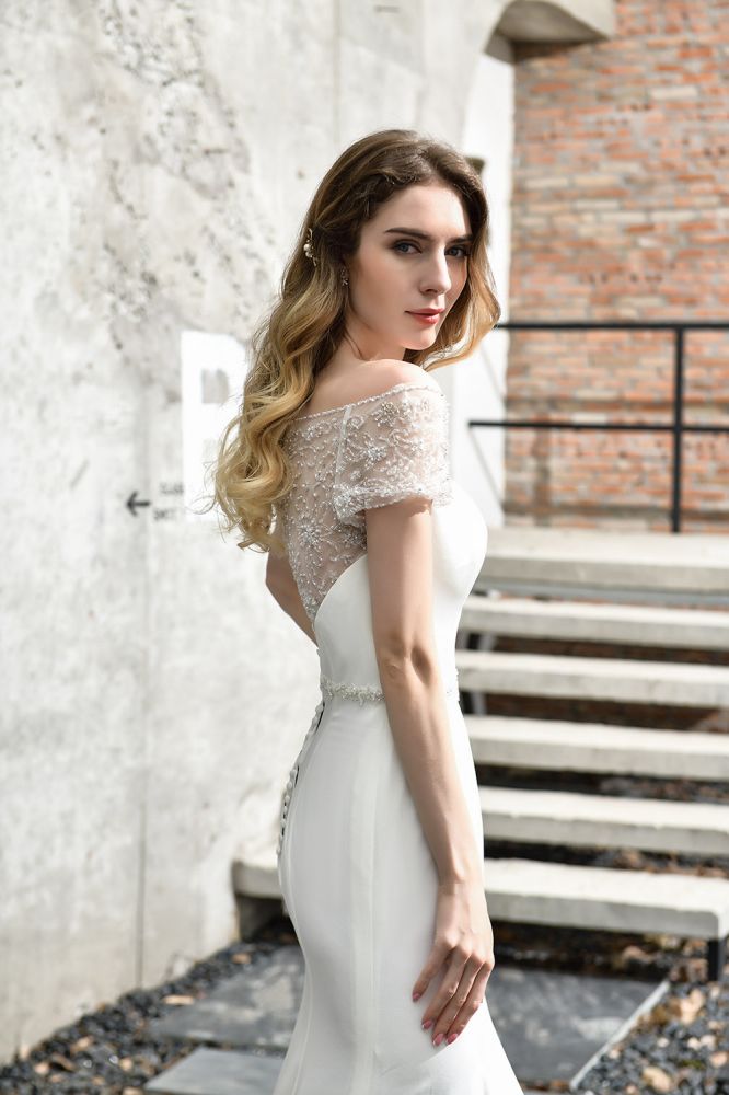 Wanna get a perfect dress for your big day. stylesnuggle has Cap Sleeve Mermaid Lace Ivory Wedding Dress avilable in White, Ivroy and champange. Try this simple bridal gowns for your summer wedding.