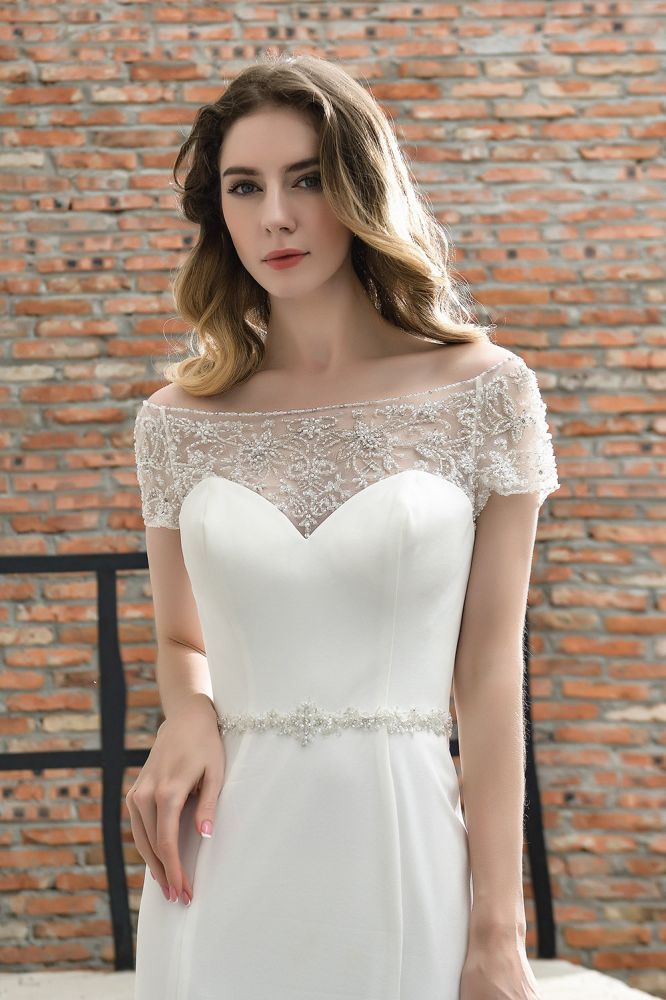 Wanna get a perfect dress for your big day. stylesnuggle has Cap Sleeve Mermaid Lace Ivory Wedding Dress avilable in White, Ivroy and champange. Try this simple bridal gowns for your summer wedding.