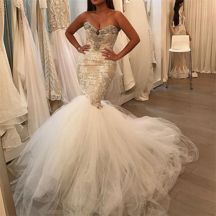 No idea what to wear for your big day? stylesnuggle custom made you this Tulle Lace Sweetheart Crystal Bridal Gowns at factory price.