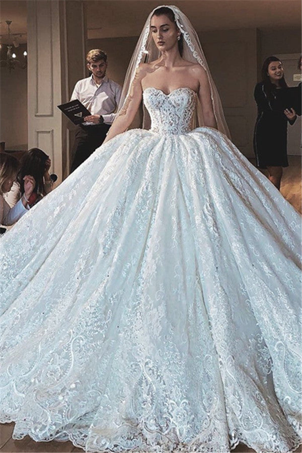 Inspired by this wedding dress at stylesnuggle.com,Ball Gown style, and Amazing Lace,Appliques work? We meet all your need with this Classic Glamorous Modern Strapless Lace Appliques Ball Gown Wedding Dress.