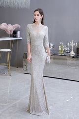 Looking for Prom Dresses, Evening Dresses, Homecoming Dresses, Quinceanera dresses in Tulle, Sequined,  Mermaid style,  and Gorgeous Beading, Buttons, Sequined work? stylesnuggle has all covered on this elegant Gorgeous Silver Long Sleevess Long Prom Dress.