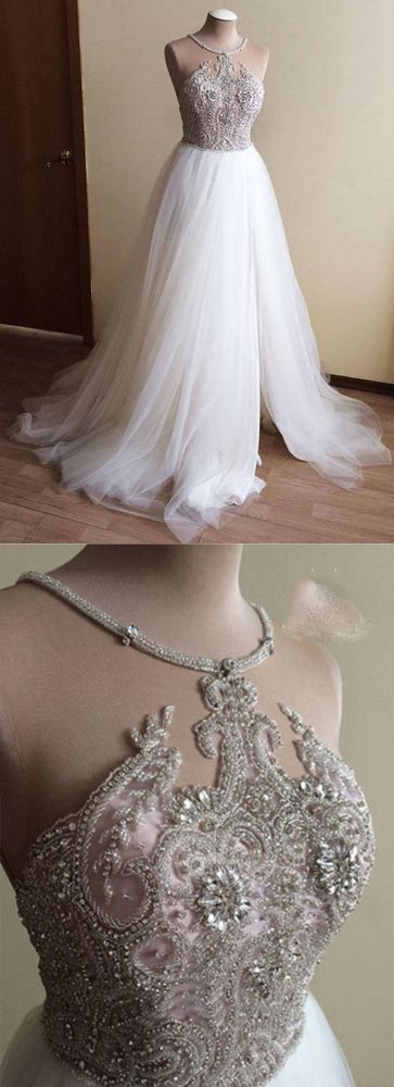 Wanna get a dress in Tulle, A-line style, and delicate Crystal work? We meet all your need with this Classic Halter Illusion neck High split A-line Tulle Princess Wedding Dress at factory price.