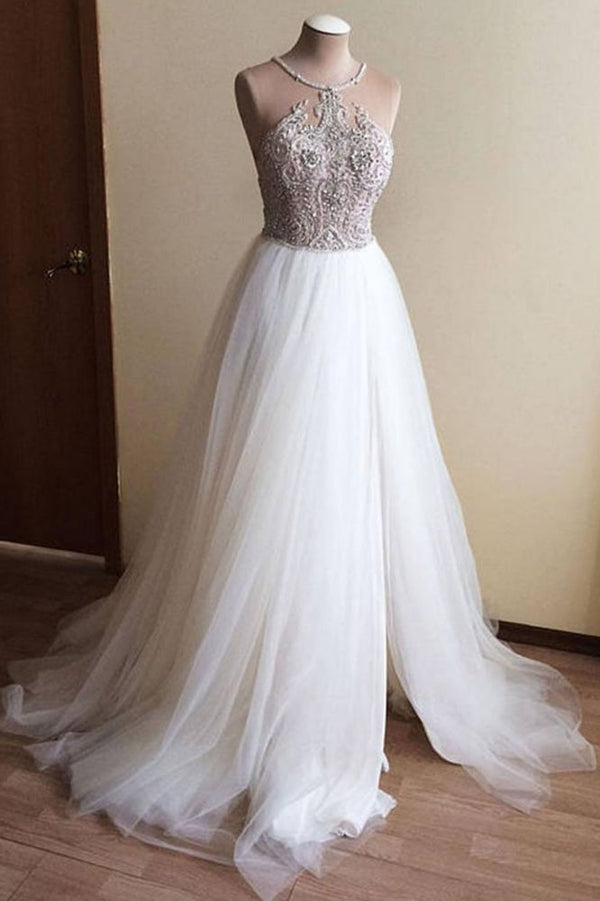 Wanna get a dress in Tulle, A-line style, and delicate Crystal work? We meet all your need with this Classic Halter Illusion neck High split A-line Tulle Princess Wedding Dress at factory price.