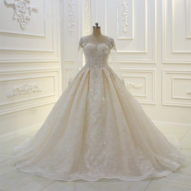 Wanna get a dress in Tulle, Ball Gown style, and delicate Lace,Beading,Appliques,Ruffless work? We meet all your need with this Classic Luxurious Ball Gown Long Sleevess Lace Applqiues Beadings Wedding Dress at factory price.