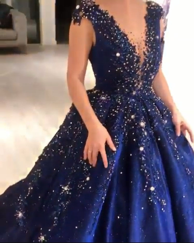 stylesnuggle offers Luxurious Dark Navy Deep V-neck Cap sleeves Ball Gown with free shipping and custom make services. Be the prom belle in the Sparkle Beaded Prom Dresses. Don't miss it out.