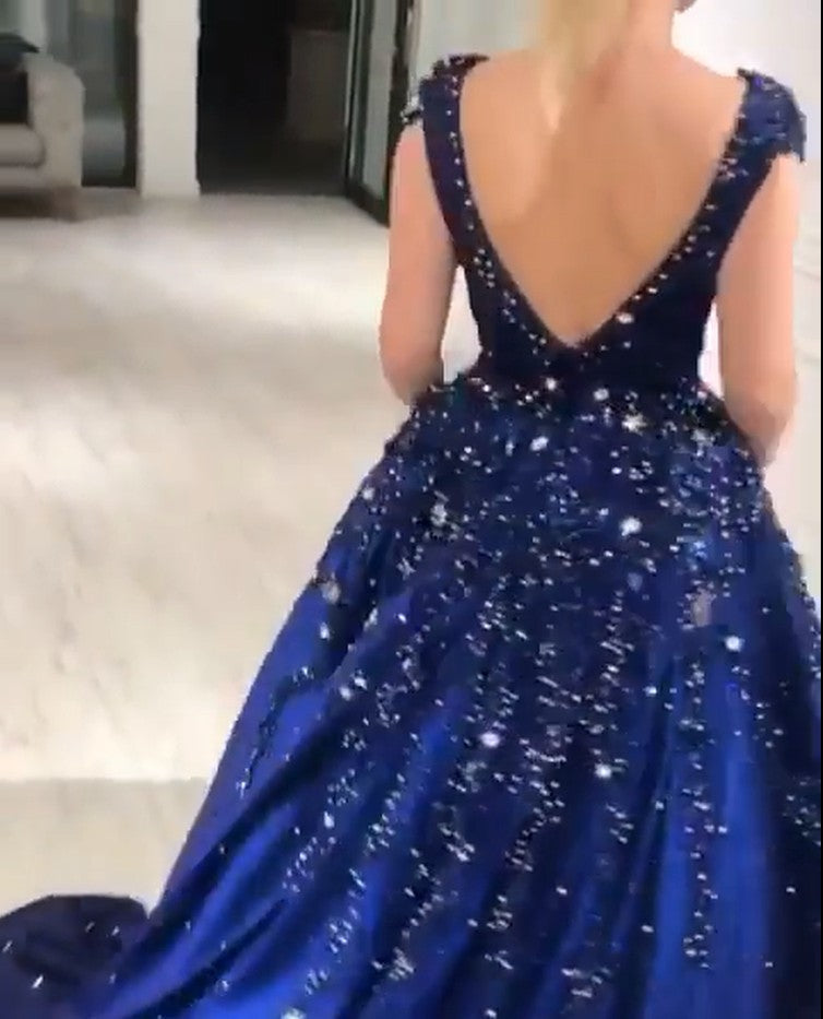 stylesnuggle offers Luxurious Dark Navy Deep V-neck Cap sleeves Ball Gown with free shipping and custom make services. Be the prom belle in the Sparkle Beaded Prom Dresses. Don't miss it out.