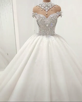 Look at This beautiful Luxurious High Neck Crystal Beading Ball Gown Wedding Dresses at stylesnuggle.com, this dress will make your guests say wow. The bodice is thoughtfully lined, and the skirt with Crystal to provide the airy, flatter look of .