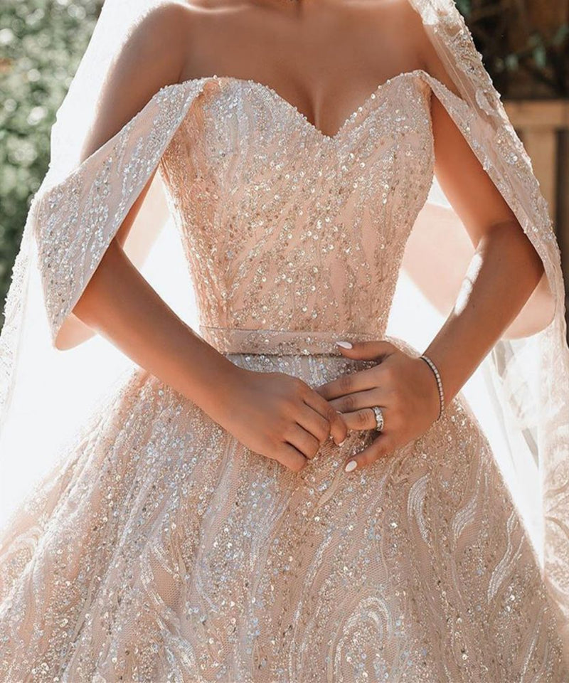 stylesnuggle offers Luxurious Off-the-Shoulder Sequins Ball Gowns for Women A-line Satin Bridal Gowns at a good price, 1000+ options, fast delivery worldwide.