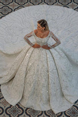 Looking for a dress in Satin, A-line style, and AmazingBeading,Sequined work? We meet all your need with this Classic Luxurious Princess Ball Gown Long Sleevess Sparkly sequins Bridal Gowns with Sweep Train.