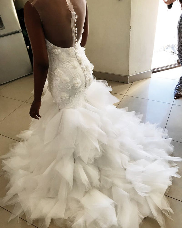 This Mermaid Floral Appliques Ruffless Wedding Dresses Sheer Tulle Backless Sleeveless Bridal Gowns at stylesnuggle comes in all sizes and colors. Shop a selection of formal dresses for special occasion and weddings at reasonable price.