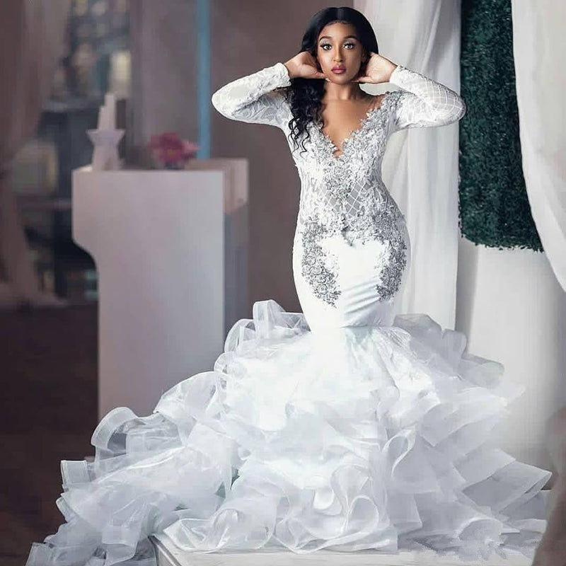 Inspired by this wedding dress at stylesnuggle.com,Mermaid style, and Amazing Beading work? We meet all your need with this Classic Modern Beading Appliques Wedding Dresses Long Sleeves Mermaid Tulle Bridal Gowns.