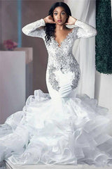 Inspired by this wedding dress at stylesnuggle.com,Mermaid style, and Amazing Beading work? We meet all your need with this Classic Modern Beading Appliques Wedding Dresses Long Sleeves Mermaid Tulle Bridal Gowns.