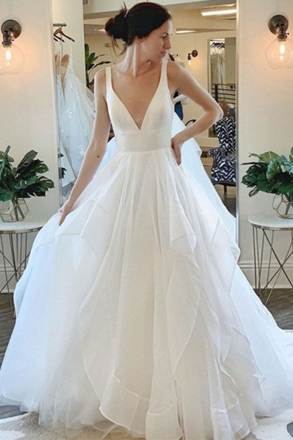 stylesnuggle offers Modern Deep V-neck Sleeveless White Tulle Wedding Dresses with Ruffless online at an affordable price from Tulle to A-line Floor-length skirts. Shop for Amazing Sleeveless collections for your bridal party.