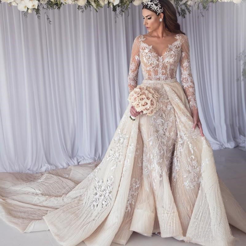 Inspired by this wedding dress at stylesnuggle.com,Mermaid style, and Amazing Lace work? We meet all your need with this Classic Modern Long Sleeves Lace Mermaid Overskirt Wedding Dress Bridal Gowns.