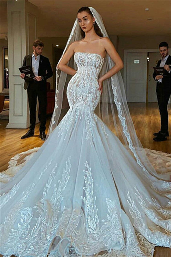 Inspired by this wedding dress at stylesnuggle.com,Mermaid style, and Amazing Lace work? We meet all your need with this Classic Modern Strapless Mermaid Puffy Appliques Bridal Bridal Gowns.