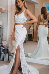 Inspired by this wedding dress at stylesnuggle.com,Mermaid style, and Amazing Lace work? We meet all your need with this Classic Modern two-pieces Spaghetti V-Neck Lace Side Slit Beach Wedding Dress.