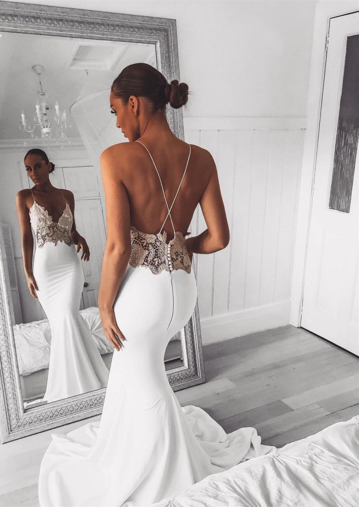 Inspired by this wedding dress at stylesnuggle.com,Mermaid style, and Amazing Lace work? We meet all your need with this Classic Modern V-Neck Lace Spaghetti Strap Mermaid Wedding Dress Open Back Bridal Gown.