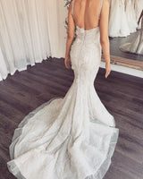 Looking for a dress in Lace, Mermaid style, and Amazing Lace work? stylesnuggle custom made you this Modern V-neck Sleeveless Lace Overskirt Bridal Gowns For Wedding latest.