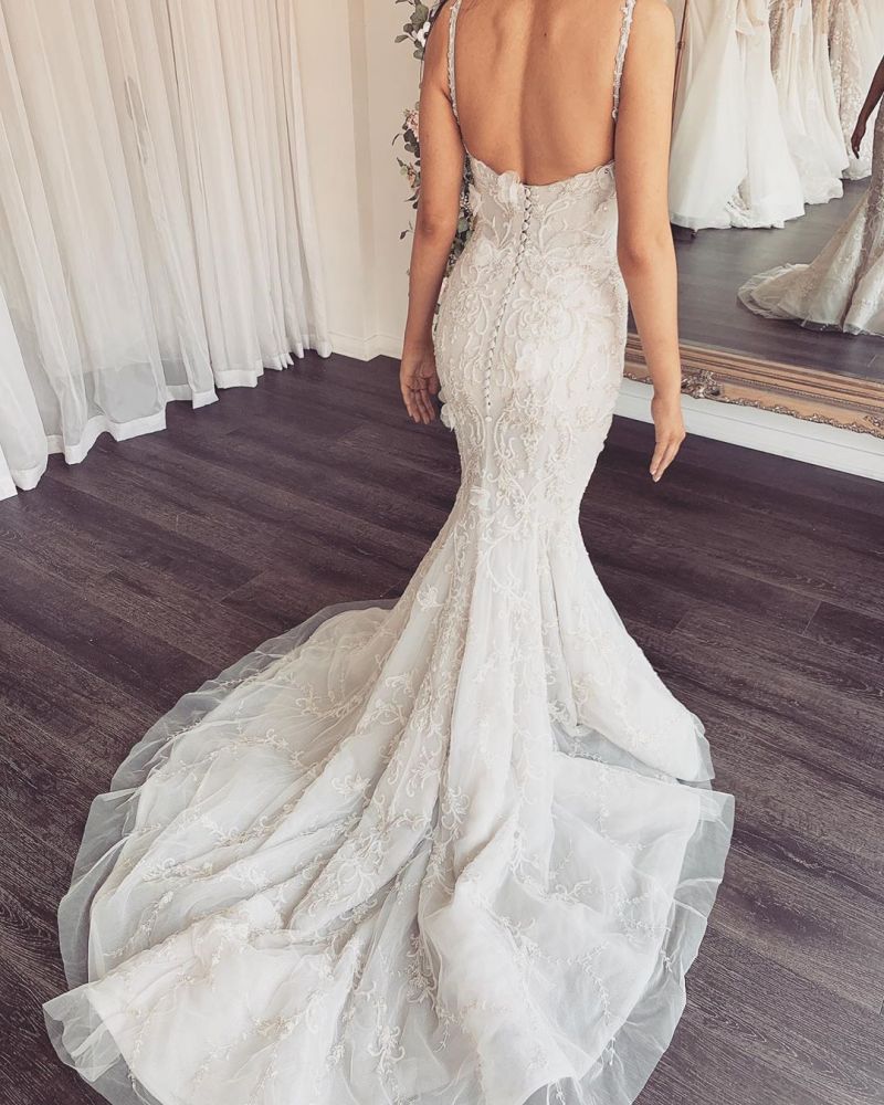 Looking for a dress in Lace, Mermaid style, and Amazing Lace work? stylesnuggle custom made you this Modern V-neck Sleeveless Lace Overskirt Bridal Gowns For Wedding latest.