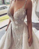 Looking for a dress in Lace, Mermaid style, and Amazing Lace work? stylesnuggle custom made you this Modern V-neck Sleeveless Lace Overskirt Bridal Gowns For Wedding latest.