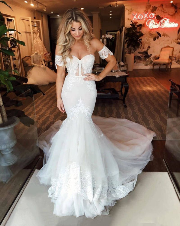 Looking for a perfect dress in Tulle, Mermaid style, and Amazing Appliques work? We meet all your need with this Classic Off-the-Shoulder Puffy Tulle Wedding Dress Mermaid Appliques Sweep Train Bridal Gowns.