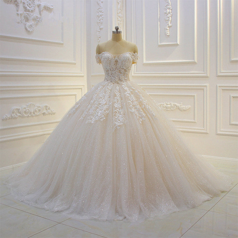 Wanna get a dress in Tulle, Ball Gown style, and delicate Lace,Appliques,Sequined work? We meet all your need with this Classic Off-the-shoulder Tulle Lace Appliques Sequined Wedding Dress at factory price.