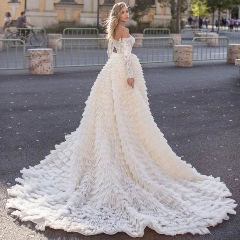 Inspired by this wedding dress at stylesnuggle.com,A-line style, and Amazing work? We meet all your need with this Classic Off the Shoulder Wedding Gown Long Sleeves Floral Mermaid with Detachable Train.