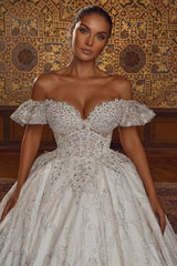 Looking for a dress in Satin,Tulle, A-line style, and Amazing Crystal,Rhinestone work? We meet all your need with this Classic Off-the-ShoulderAline Ball Gown Wedding Dress Floral Lace.