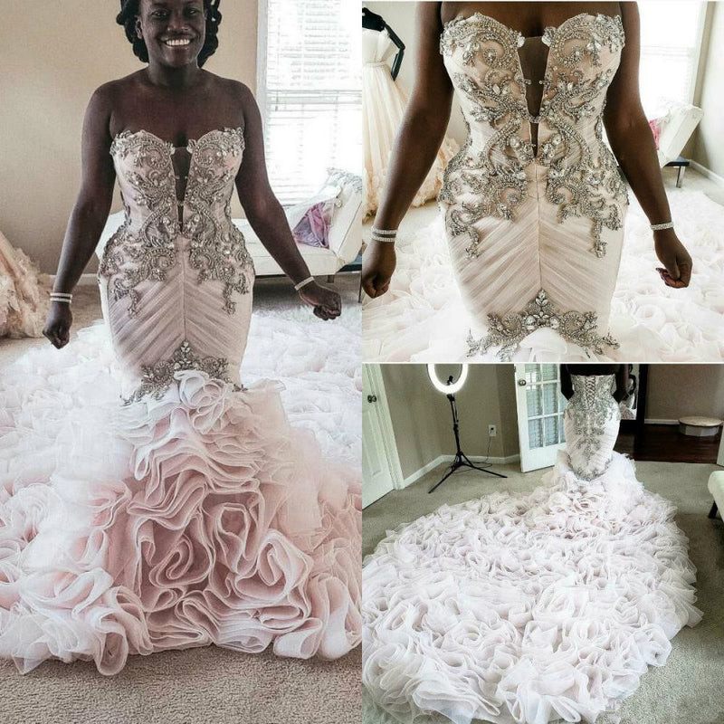 stylesnuggle offers Plus Size Mermaid Crystal Lace Beads Sweetheart Long Train African Custom Made Ruffless Wedding Dresses online at an affordable price from Satin,Taffeta,Hard Net to Ball Gown Floor-length skirts. Shop for Amazing Sleeveless wedding collections for your big day.