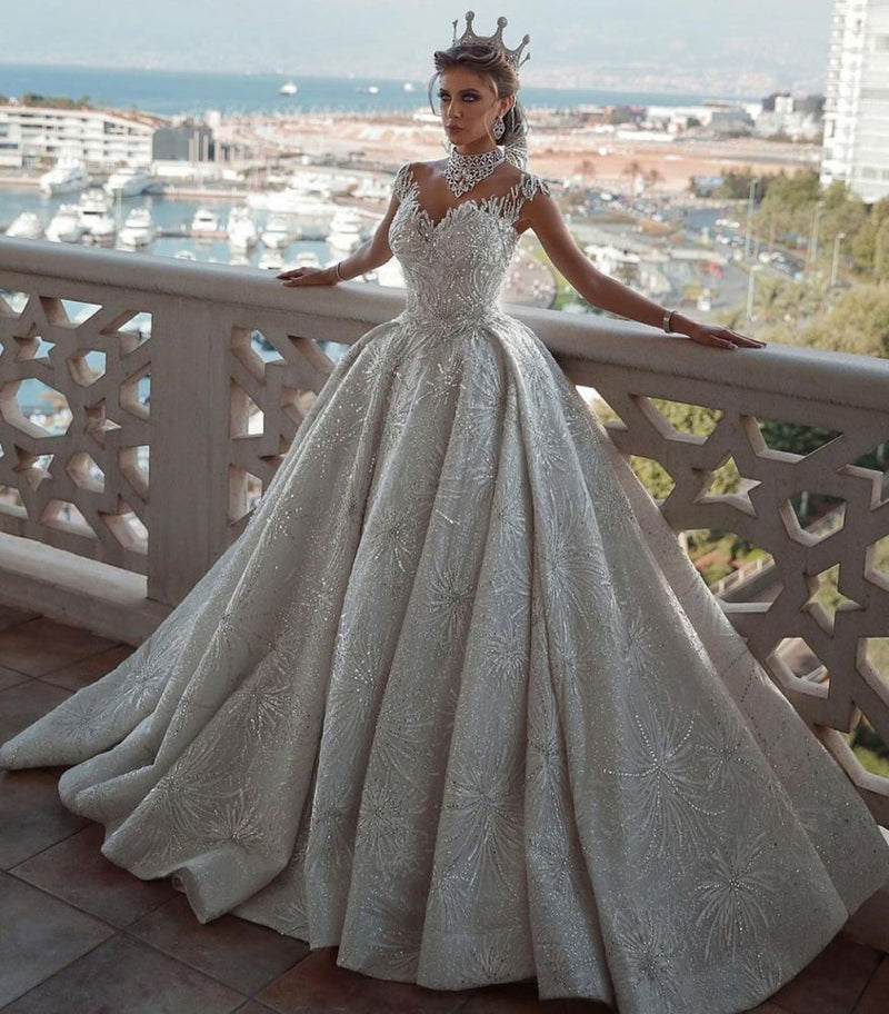 stylesnuggle offers Romantic Sequined Pattern A-line Wedding Dress V-Neck Sleeveless Crystal Gowns at a good price, 1000+ options, fast delivery worldwide.